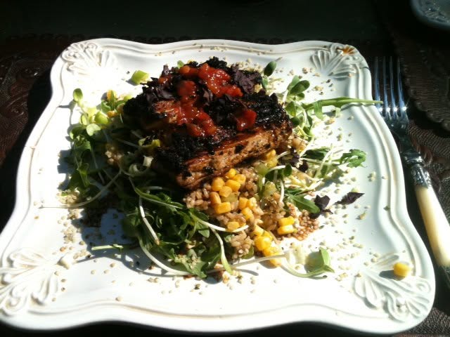 Blackened ahi on sprouts and arugula with brown rice, corn, hemp seeds, and savories with namu shoyu dressing