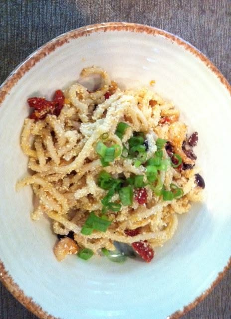 Fat pasta with mazithra cheese, diablo shrimp, kalamata olives and sun dried tomato checa