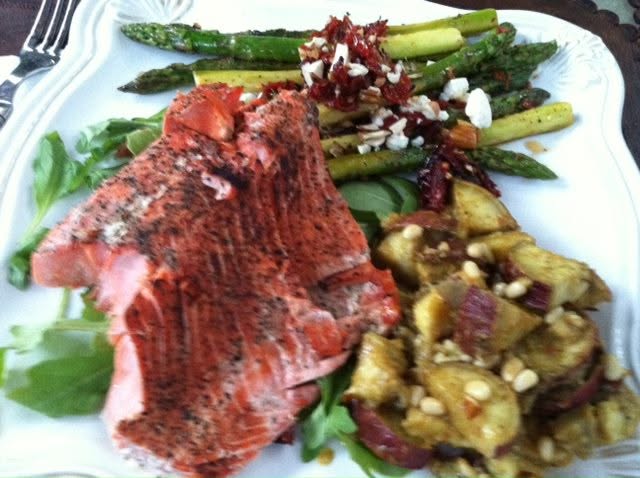 seared and flamed lemon salmon sautéed asparagus with curried spicy orientals (type of sweet potato) all served over arugula with feta