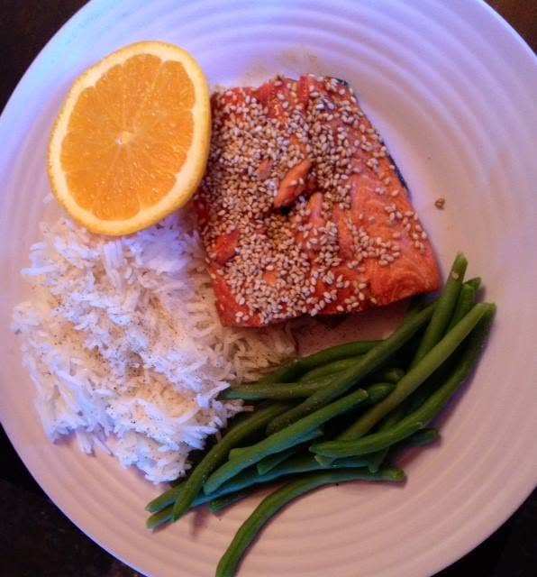 Sesame seed encrusted wild salmon with a dark molasses soy demi-glaze, Persian long grain princess rice and fresh organic green beans