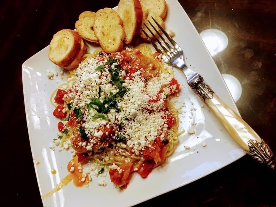 Chicken Cacciatore (Preparazione alla cacciatora)with goat cheese and basil on angel hair pasta