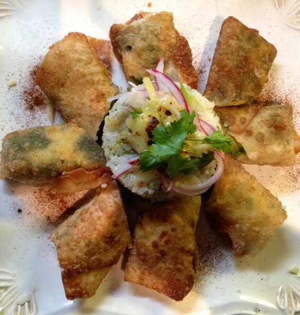 Fried Avocado topped with lime red onion compote served with a cilantro pepper rice