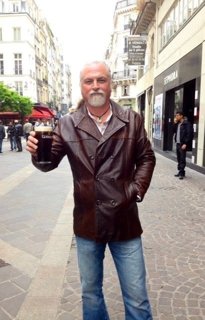 Walking along with a beer in hand - got to love paris